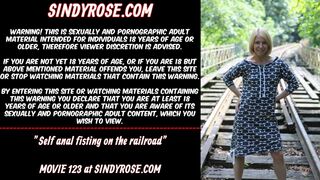 Self butt-sex fisting on the railroad
