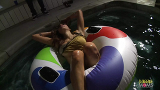 Brunette girl fucking with a friend after taking a late night swim in the pool