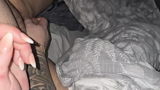 Tattooed step mom hand slip into step son prick for a hand-job